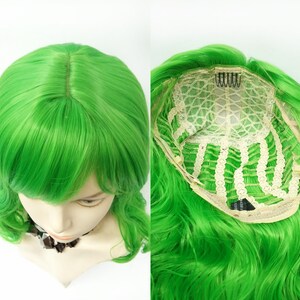 May include: A bright green wig with long, wavy hair and a side part. The wig has a lace front and adjustable straps.