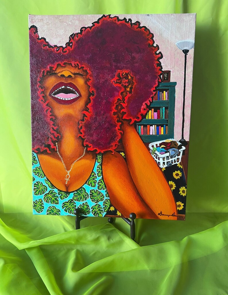 May include: A painting of a woman with a large, curly, red afro. She is wearing a green and blue tank top with a silver necklace. The background is a room with a bookshelf and a lamp.
