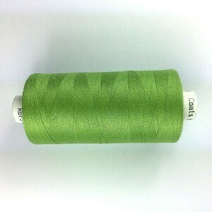 May include: A spool of Coats green sewing thread.
