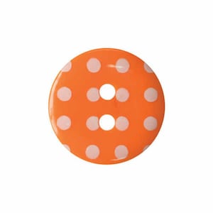 May include: Orange button with white polka dots and two holes in the centre.