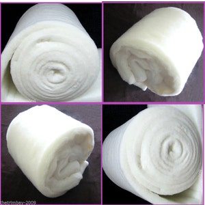 May include: A white, rolled up batting material for crafts. The batting is soft and fluffy, and it is perfect for adding padding to projects.
