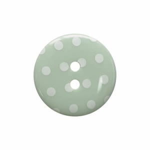Peut inclure: Un bouton vert clair avec des pois blancs et deux trous.