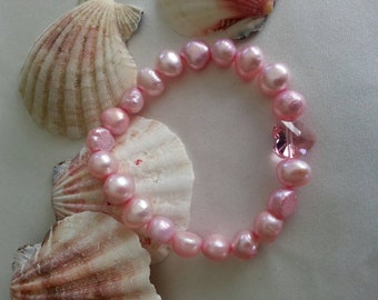 Pink pearl bracelet. Austrian crystal heart bracelet. Dyed pink pearls bracelet. Stretch bracelet. Crystal charm bracelet. Girl's size 7".