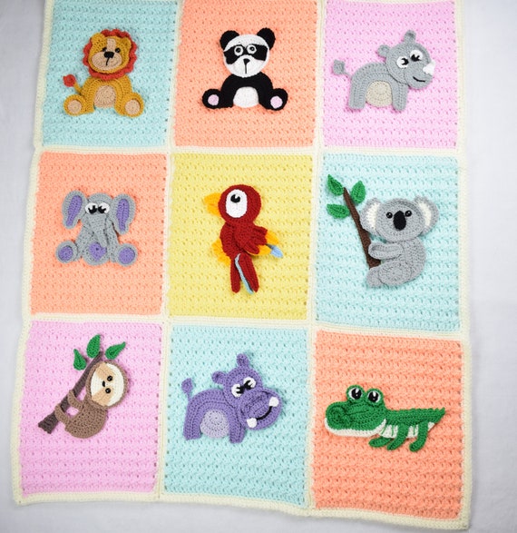 Crochet baby blanket with animal applique hotsell