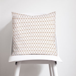 White and Copper Geometric cushions
