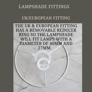 May include: White metal lampshade fitting for UK and European lamps. The fitting has a removable reducer ring that fits lamps with a diameter of 40mm and 27mm.