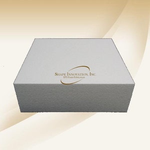 May include: A white rectangular block of expanded polystyrene foam. The block has a logo on the top that reads "SHAPE INNOVATION, INC. EPS Foam Fabrication".