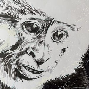 May include: A black and white illustration of a monkey's face, with detailed linework. The monkey has large eyes, a small nose, and a slightly open mouth. The background is black with white splatters.