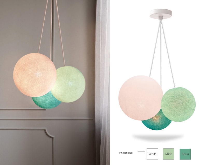 May include: A three-light pendant lamp with cotton ball shades in white, mint green, and aqua blue. The lamp is hanging from a white ceiling fixture.