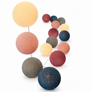 May include: A string of decorative spherical lights featuring a textured, woven thread finish. The globes come in a variety of colors including cream, dusty pink, dark red, navy blue, and slate gray, arranged along a thin, flexible white wire.