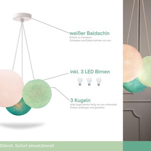 May include: A white ceiling fixture with three hanging cotton ball light shades in pink, green, and teal. The fixture includes three LED bulbs and a white canopy.