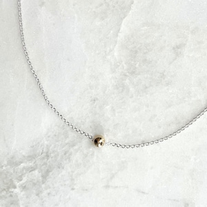 Dainty two tone gold and silver necklace, single gold ball bead on sterling silver chain
