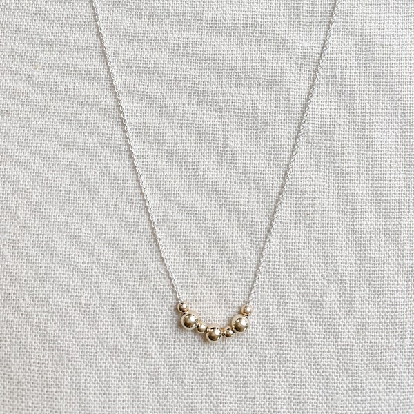 Dainty two tone metal necklace, silver chain and alternating size tiny gold filled ball beads