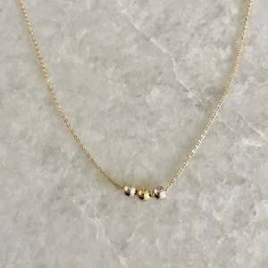 Simple gold and silver bead necklace, three two tone beads, dainty mixed metal jewelry