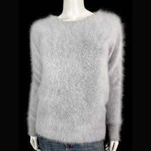 May include: A light gray, fuzzy sweater with a crew neck and long sleeves. The sweater is displayed on a mannequin against a black background. The material appears soft and textured, suggesting a cozy, warm garment.
