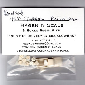 May include: A clear plastic bag contains unassembled model parts and a white card. The card reads "1/160 N scale 1960s Studebaker Pick Up Truck" and "Hagen N Scale N Scale Resin Kits". The model parts are off-white.
