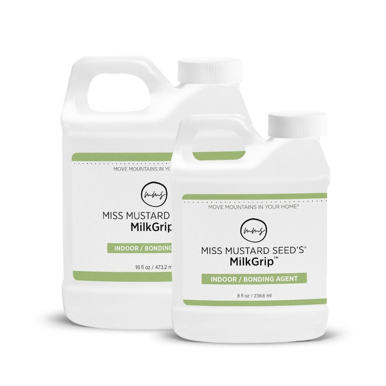 Pode incluir: Dois recipientes de pl&aacute;stico branco de MilkGrip da Miss Mustard Seed. O recipiente maior tem 473,2 ml, e o menor 236,6 ml. Ambos t&ecirc;m uma faixa verde com as palavras "INDOOR / BONDING" e o nome da marca.