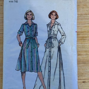 May include: Vintage Butterick sewing pattern for a size 16 dress. The illustration shows two women wearing button-down dresses. One dress is striped in blue, green, and pink. The other dress is solid white. The pattern is titled "The Fashion One."