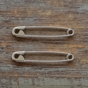 This is a pair of Safety Pin Earrings made from sterling silver.
These safety pins are 3.1cm long and weighs 1 gram.
Here is some details of the item:
Sterling Silver-Glossy finish-Hand made-925 Stamped