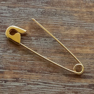 This is one 1.25 inches Gold Safety Pin Brooch which is 3.1 cm long and the weight is 0.5 gr.
I hallmark all the items.Here is some details of the item:
Gold-Glossy finish-Hand made-Hallmarked.