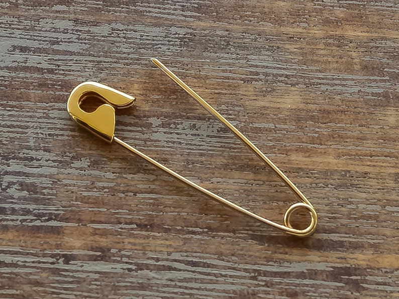 This is one 1.25 inches Gold Safety Pin Brooch which is 3.1 cm long and the weight is 0.5 gr.
I hallmark all the items.Here is some details of the item:
Gold-Glossy finish-Hand made-Hallmarked.