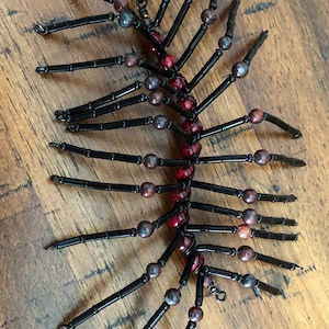 Black and red beaded centipede