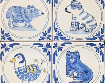Set of four little Delft Animal tiles