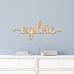 May include: Wooden wall decor with the word "explore" written in a cursive font.