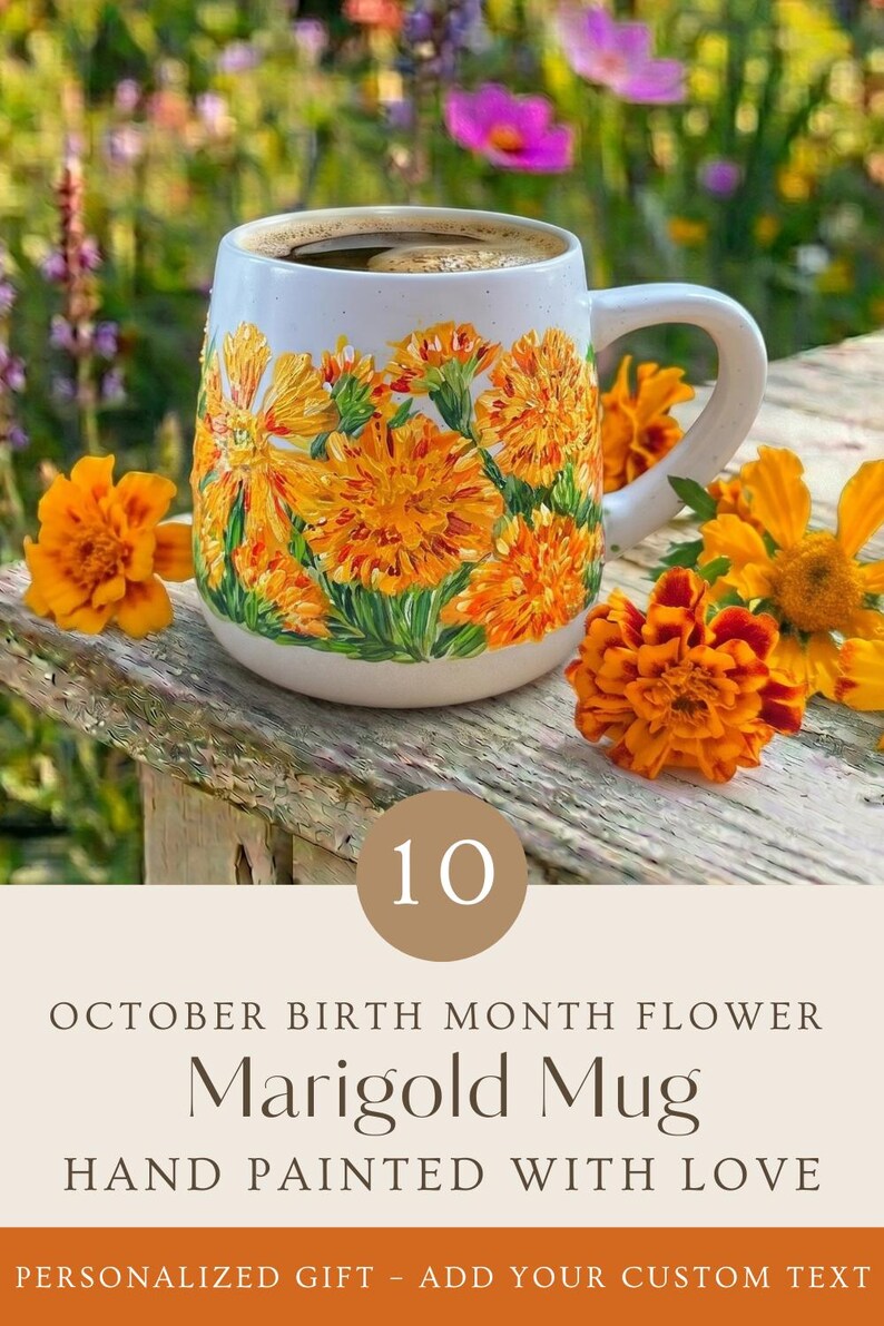 May include: A white ceramic mug featuring hand-painted orange marigold flowers. The text on the image reads: 10 OCTOBER BIRTH MONTH FLOWER Marigold Mug HAND PAINTED WITH LOVE PERSONALIZED GIFT - ADD YOUR CUSTOM TEXT.