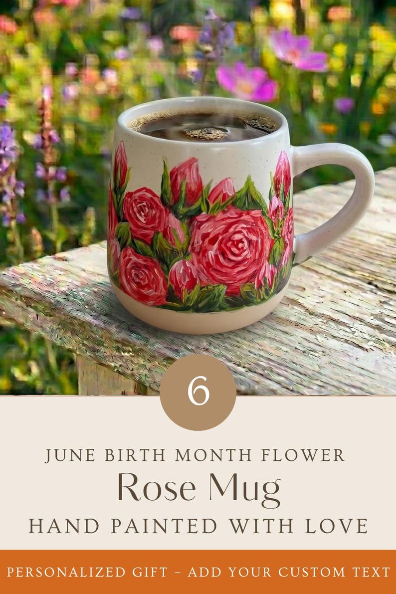 May include: A cream-colored ceramic mug featuring a hand-painted design of vibrant red roses and green leaves. The mug is filled with dark coffee and includes the text 6 JUNE BIRTH MONTH FLOWER Rose Mug HAND PAINTED WITH LOVE.
