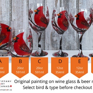May include: A collection of hand-painted glassware featuring a vibrant red cardinal bird design. The set includes a beer mug, stemless wine glasses, and stemmed wine glasses. Each glass showcases the bird perched on a branch with red berries. The sizes range from 6.5oz to 20oz.