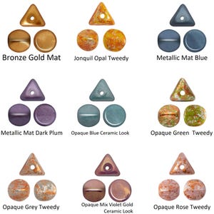 May include: A collection of beads in various colors and finishes. The beads include triangular and round shapes. Colors include bronze, gold, blue, purple, green, grey, violet, and rose. The image includes the text "Bronze Gold Mat", "Jonquil Opal Tweedy", "Metallic Mat Blue", "Metallic Mat Dark Plum", "Opaque Blue Ceramic Look", "Opaque Green Tweedy", "Opaque Grey Tweedy", "Opaque Mix Violet Gold Ceramic Look", and "Opaque Rose Tweedy".