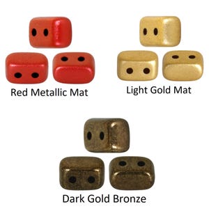 May include: Three sets of square beads in different colours: red metallic matte, light gold matte, and dark gold bronze. Each set has three beads with two holes.