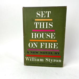 May include: A vintage hardcover book titled "SET THIS HOUSE ON FIRE" by William Styron. The book has a dark green cover with the title in large white letters and colorful horizontal lines. The author's name is in white.