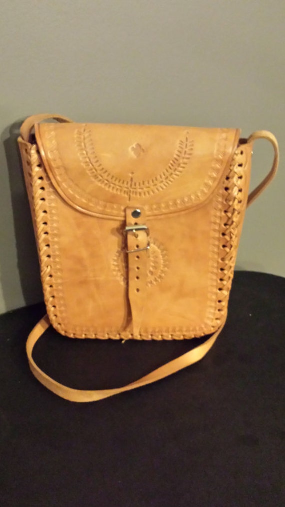Tooled leather handbag.