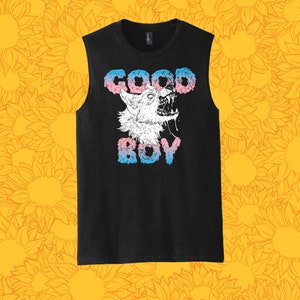 May include: Black sleeveless tank top with a graphic print of a wolf's head with the text "GOOD BOY" in pink, blue, and white.