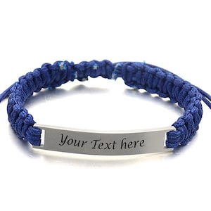 May include: Two adjustable bracelets with a silver nameplate. The blue bracelet has the text "Your Text here" on the nameplate. The brown bracelet has the text "Free Engraving" on the nameplate.