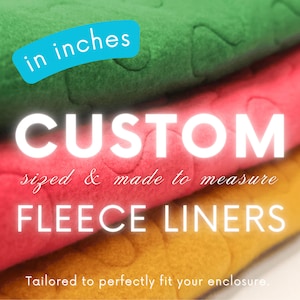 May include: A stack of custom fleece liners in green, red, and yellow. The text reads "CUSTOM sized & made to measure FLEECE LINERS" with "in inches" in a blue box. The bottom text says "Tailored to perfectly fit your enclosure."