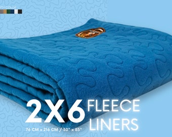 May include: A folded blue fleece liner, measuring 30" x 85", with a repeating pattern. The text "2X6 FLEECE LINERS" is displayed. The liner has a gold emblem. The image also shows a color selection bar.