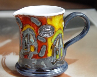 Hand-Glazed 10 oz Colorful Pottery Milk Jug: Radiant Orange and Red and Tranquil Blue - Perfect Gift Idea!