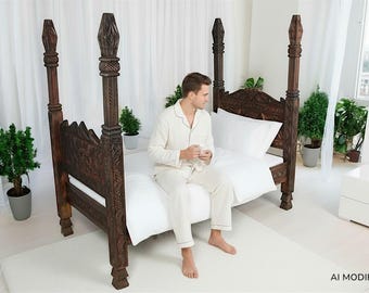 May include: A dark brown wooden four-poster bed with intricate carved details on the headboard and tall, decorative posts. The bed is dressed with crisp white bedding, including a duvet and pillows, creating a clean and neutral aesthetic.