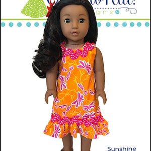 May include: A doll wearing a bright orange and pink floral dress with a ruffled hem. The dress has a pink polka dot trim. The doll has brown skin and long dark hair. The text "Sunshine Dress" is at the bottom of the image.