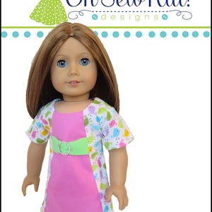 May include: A pink and white dress with a green belt and a bird print pattern. The dress is designed for a doll and is called "Sunshine Dress".