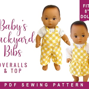 May include: A PDF sewing pattern for a baby's overalls and top, designed to fit 8-inch dolls. The pattern features a yellow and white checkered fabric with a pink title that reads "Baby's Backyard Bibs OVERALLS & TOP".