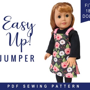 May include: PDF sewing pattern for an easy-to-make jumper for 18-inch dolls. The jumper is black with a floral print and pink trim. The text "Easy Up! Jumper" is in blue on a white background.