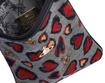 Vivienne Westwood Hearts Crossbody Bag. Hearts and logo pattern with zip closure and leather strap, designer piece.