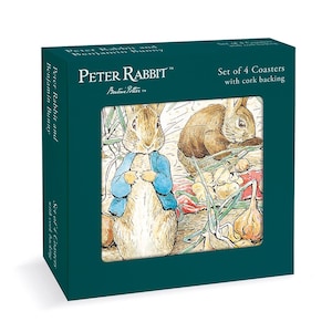 May include: A dark teal box containing a set of 4 coasters with cork backing. The packaging features the text Peter Rabbit and Benjamin Bunny, Beatrix Potter, and Set of 4 Coasters with cork backing, with an illustration of the characters.
