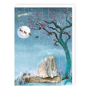 May include: An advent calendar featuring a blue night sky with a full moon, a shooting star, and a tree with purple blossoms. Two rabbits sit on a log at the base of the tree. The calendar has twenty-four numbered squares arranged in a grid.