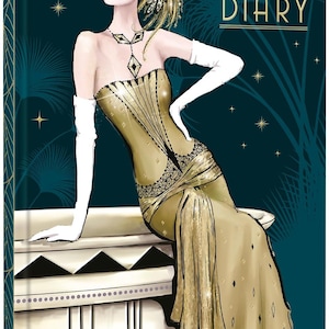 May include: A 2027 diary with a dark teal cover featuring an illustration of a figure in a gold gown, white opera gloves, and a gold headpiece. The figure sits on a white surface against a background of gold stars and palm leaf silhouettes.