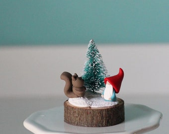 Micro mini gnome with tiny squirrel and Christmas tree on wood slice